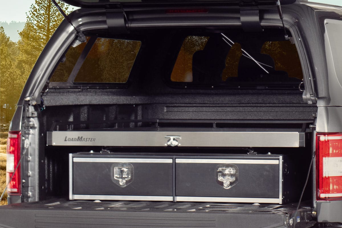 Close up of a loadmaster bed system in a grey pick up truck