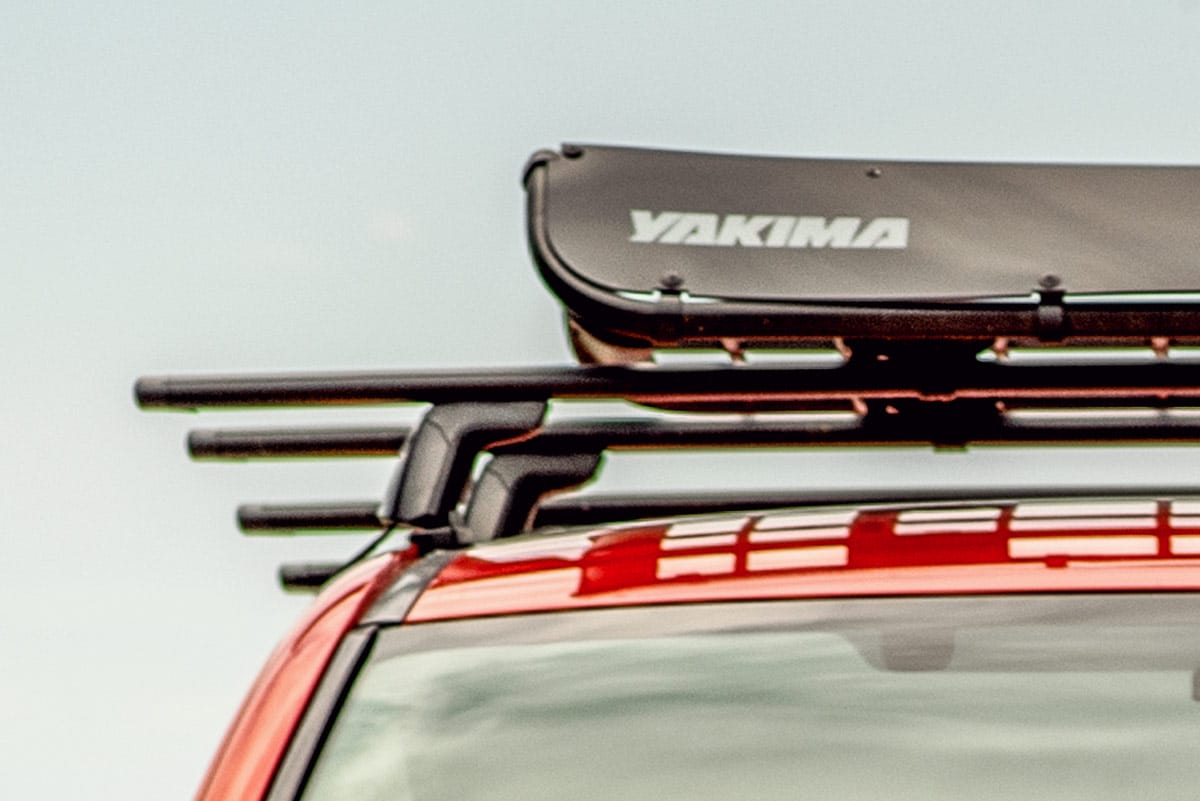 Close up of a yakima roof rack on a red vehicle